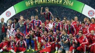Bayern Munich players celebrate after they beat Borussia Dortmund in the German Cup final on Saturday. Kay Nietfeld / EPA / May 17, 2014