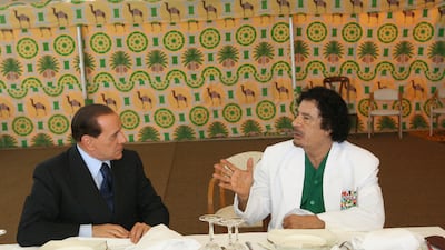 Former Libyan leader Muammar Qaddafi meets Mr Berlusconi in a tent in Sirte in June 2008. Mr Berlusconi was seeking a deal to stop thousands of illegal immigrants from reaching Italian shores. AFP