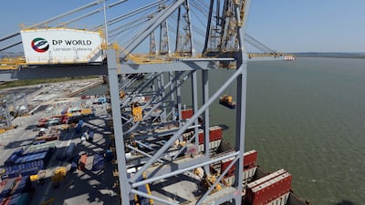 Cranes unload containers during testing at the London Gateway port being constructed in the Thames Estuary near London. Stephen Lock for The National