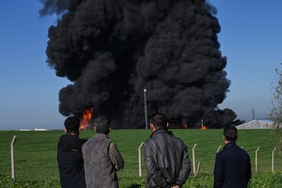 Smoke billows from an oil warehouse in the Kani Qirzhala area on the outskirts of Erbil. AFP