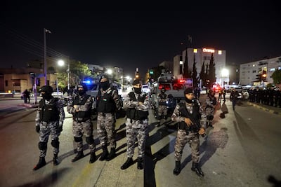 Jordanian security forces keep watch during a pro-Palestinian rally in Amman. The kingdom faces challenges in maintaining a balance between its US alliance and containing popular outrage at Israel. EPA