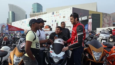 From left: Motorcyclists Mubarak Saeed, Ahmed Al Bastki, Ali Al Thahri, Eisa Al Shaiba and Majed Majjan hang out at Gulf Bike Week in Dubai Festival City in 2011. Amy Leang / The National