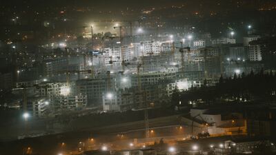 Cranes at night at a Turkish public housing agency construction area in Antakya, two years after an earthquake devastated south-eastern Turkey and northern Syria. AFP
