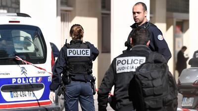 Police work at the site where a car slammed into soldiers on patrol in in the northwestern suburb of Levallois-Perret. Stephane De Sakutin.
