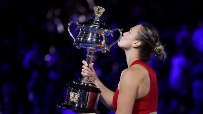 Aryna Sabalenka poses with the Daphne Akhurst Memorial Cup after beating Qinwen Zheng 6-3, 6-2. Getty Images