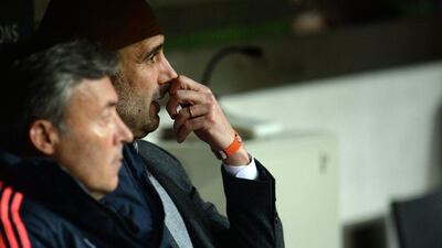 Pep Guardiola watches on from the dugout during Bayern Munich's Uefa Champions League semi-final second leg against Atletico Madrid. Andreas Gebert / EPA