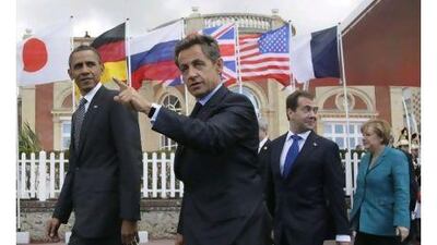 From left, President Barack Obama, French President Nicolas Sarkozy, Russian President Dmitry Medvedev, and German Chancellor Angela Merkel, walk together to the first plenary session at the G8 Summit, in Deauville, France, yesterday.