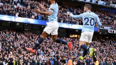Sterling, left, and Silva celebrate. Getty