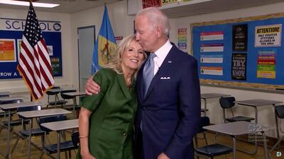 U.S. Democratic presidential candidate Joe Biden kisses his wife Jill Biden on the forehead at Brandywine High School, where she taught English from 1991 to 1993, during the virtual 2020 Democratic National Convention. REUTERS