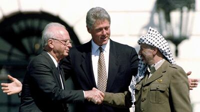 US president Bill Clinton with Israeli prime minister Yitzhak Rabin and Palestine Liberation Organisation leader Yasser Arafat after the peace accord in Washington, in September 1993. Gary Hershor