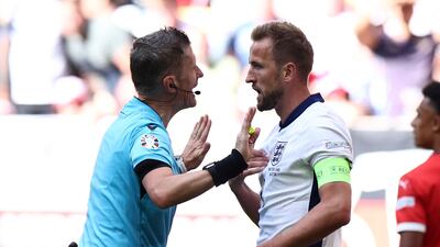 England captain Harry Kane talks with Italian referee Daniele Orsato. EPA