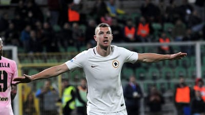 Roma's Edin Dzeko celebrates a Serie A goal against Palermo vs AS Roma, on March 12, 2017 in Palermo. Alessandro Fucarini / AFP