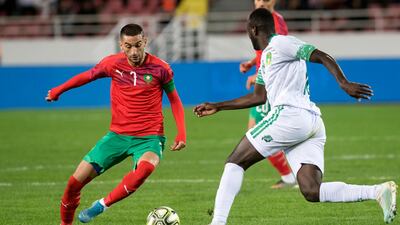 Morocco's midfielder Hakim Ziyech, left, vies for the ball with Mauritania's Hacen El Ide during the 2021 Africa Cup of Nations group E qualifying match in 2019. AFP