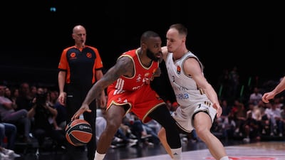 Crvena Zvezda's Codi Miller-Mcintyre, left, and Klemen Prespelic of Dubai Basketball. EPA