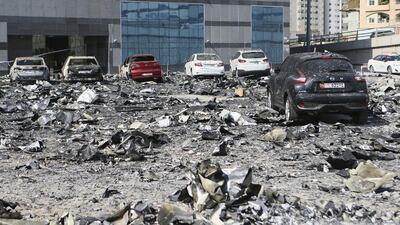 Debris and charred remains in the car park at the Adbul Naser building in Sharjah, which caught fire last week. Readers say safety regulations must be enforced to limit further fires. Sarah Dea / The National