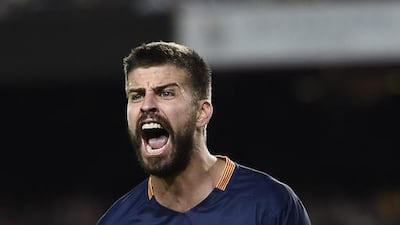 Barcelona defender Gerard Pique will miss the first four matches of the new Primera Liga season for abusing match officials. AFP PHOTO / JOSEP LAGO