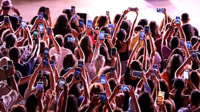 Fans of French-Palestinian singer Marwane Abdelhamid, 'Saint-Levant', watch his performance during the 59th International Festival of Carthage at the Carthage National Museum in Tunis, Tunisia. EPA