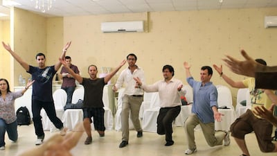 Participants warming up ahead of a comedy workshop led by Dean Obeidallah, an American comedian, organised by the Dubomedy Arts School. Randi Sokoloff for The National