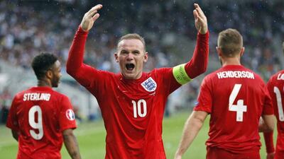 England's Wayne Rooney celebrates his goal during the Euro 2016 Group E qualifying soccer match between Slovenia and England, in Ljubljana, Slovenia, Sunday, June 14, 2015. (AP Photo/Darko Bandic)