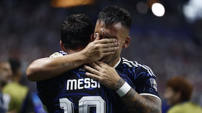 Lautaro Martinez celebrates with Lionel Messi after scoring Argentina's second goal in their 2-1 World Cup semi-final win over England in Atlanta. EPA