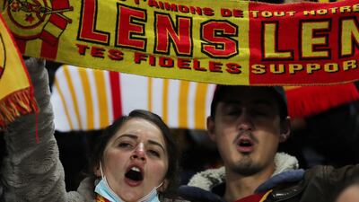 RC Lens fans cheers their team at Stade Bollaert-Delelis. Reuters