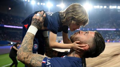 Sergio Ramos with one of his children. Reuters