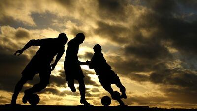 The three ages of Sir Stanley Matthews statue at the Britannia Stadium shown before the Premier League match between Stoke City and Chelsea on Saturday. Richard Heathcote / Getty Images