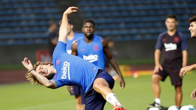 Antoine Griezmann, right, and his Barcelona teammates take part in a training session at the Machida Municipal Athletic Stadium in Tokyo. AP Photo