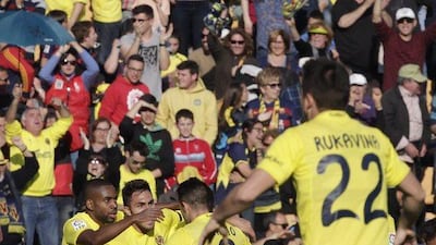 Villarreal’s players celebrate their second goal against Barcelona during the Spanish La Liga match between Villarreal and Barcelona at the Madrigal stadium in Villarreal, Spain, Sunday, March 20, 2016. (AP Photo/Alberto Saiz)