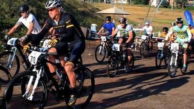 Lance Armstrong, left in black, was just part of the pack in the Power of Four mountain bicycle race in Aspen, Colorado.