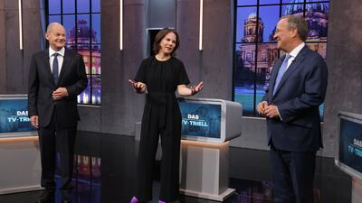 Candidates to become the next leader of Germany -- Olaf Scholz (left), Annalena Baerbock and Armin Laschet -- take part in a final televised debate in Berlin before Sunday's elections. Photo: Getty