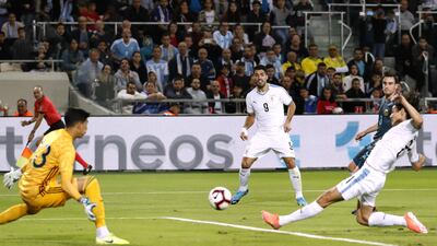 Uruguay's forward Edinson Cavani scores the opener. AFP