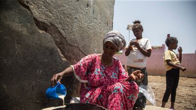 Alem Ande, from Eritrea, bakes bread to sell in the camp. She divorced her violent husband and was living in Hitsats camp in Tigray with her five children until war broke out in November 2020, when they fled to Sudan. Getty