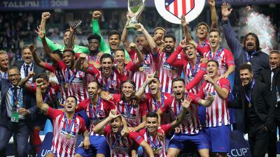 Atletico Madrid celebrate with the trophy following the UEFA Super Cup against Real Madrid in Tallinn, Estonia. Getty