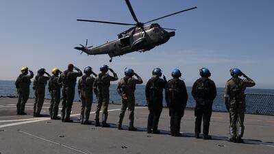 German sailors salute as the helicopter carrying Chancellor Olaf Scholz leaves a navy frigate in the Baltic Sea. Getty