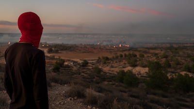 "We're choking on the air here," said a young protester in Agareb on Wednesday as he surveyed the tear gas and fires across from the large landfill on the outskirts of the town. Photo: Erin Clare Brown / The National