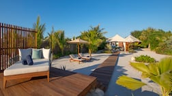 Each villa has an expansive backyard, closed in on three sides with shrubbery and leading to a private beach from the fourth. Photo: Ritz-Carlton RAK Al Hamra Beach