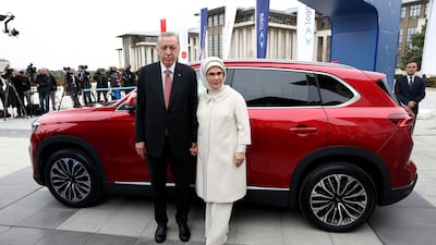 Turkey's President Recep Tayyip Erdogan and his wife Emine receive a Togg T10X, the country's first domestically-produced electric car, in Ankara. All photos: AFP