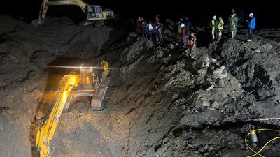 Diggers are used to clear way to a tunnel at the Trishuli 3A Hydropower Project, after the flash floods. Reuters