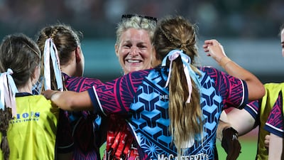 Dubai Warriors celebrate after defeating Dubai College during the Gulf Under-19 Girls final at the Emirates Dubai Sevens. Victor Besa / The National