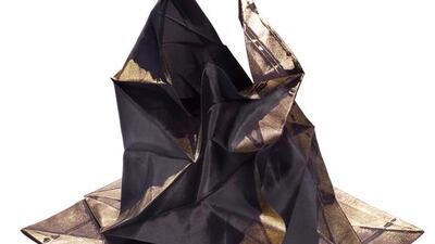 132 5 Dress, 2010, is folded, origami-style according to precise computer calculations. It is part one of a two-piece ensemble by the Japanese designer Issey Miyake, by Reality Lab, an experimental design laboratory headed up by Miyake, and the Miyake Design Studio. Hiroshi Iwasake / Courtesy Museum of Fine Arts, Boston.