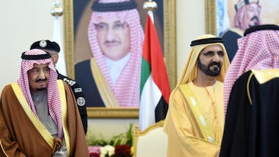Sheikh Mohammed bin Rashid, Vice President and Ruler of Dubai, greets Saudi officials in the presence of King Salman of Saudi Arabia, left, at the 136th Gulf Cooperation Council summit in Riyadh on Wednesday. Fayez Nureldine / AFP