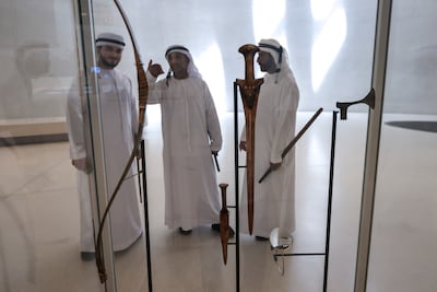 Replica bow and arrows dating to about 200 BCE are displayed in The Journey of Unity Through Time at Zayed National Museum. Victor Besa / The National