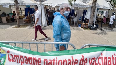 An Algerian medic stands at a Covid-19 vaccination site in front of the El Kebir mosque in the capital Algiers