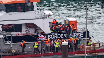 Migrants disembark from a British Border Force vessel in Dover, on the UK's south coast. Reuters
