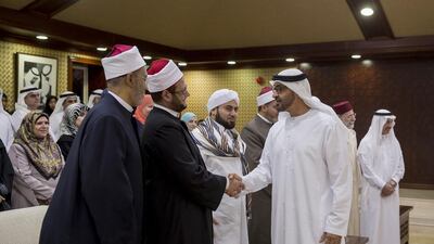 Sheikh Mohammed bin Zayed, Crown Prince of Abu Dhabi and Deputy Supreme Commander of the Armed Forces greets a President’s guest religious scholar during a lecture by Dr Mohammed Mokhtar Gomaa, Minister of Religious Endowments of Egypt (not shown), titled “Protecting Society Against Extremism”, at Majlis Mohammed bin Zayed. Mohamed Al Hammadi / Crown Prince Court - Abu Dhabi