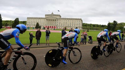 Riders of Team Garmin compete during the time trial in Belfast to begin the 2014 Giro d'Italia on Friday. Luk Benies / AFP