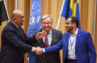 Yemen's foreign minister Khaled Al Yamani, left, shakes hands with the Houthi rebel's chief negoitator Mohammed Abdelsalam under the eyes of United Nations Secretary General Antonio Guterres during peace talks in Rimbo, north of Stockholm, Sweden. AFP