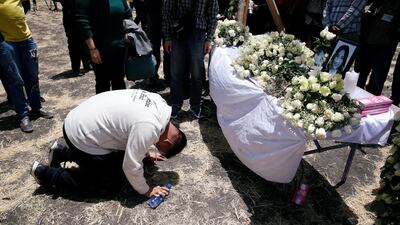 A Chinese man mourns a victim of the Ethiopian Airlines Flight ET 302 plane crash during a commemoration ceremony at the scene of the crash, near the town of Bishoftu, southeast of Addis Ababa, Ethiopia. Reuters