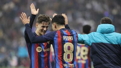 Barcelona's midfielder Pedri celebrates with Gavi after scoring his team's third goal in the Spanish Super Cup final football match against Real Madrid in Riyadh, Saudi Arabia, on Sunday. AFP